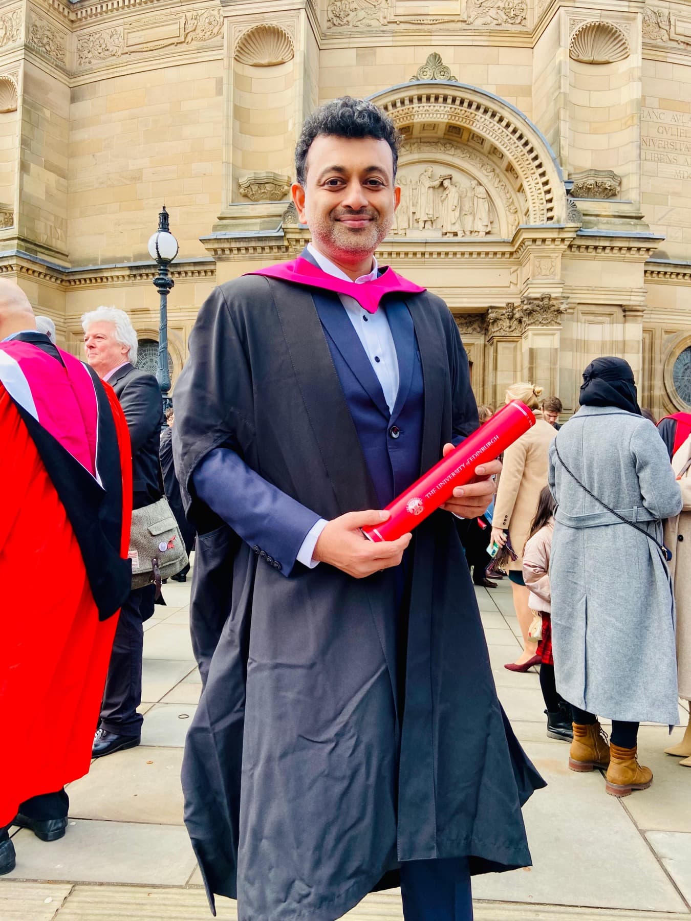Dr. Gopi Krishna Reddy G holding a University of Edinburgh scroll