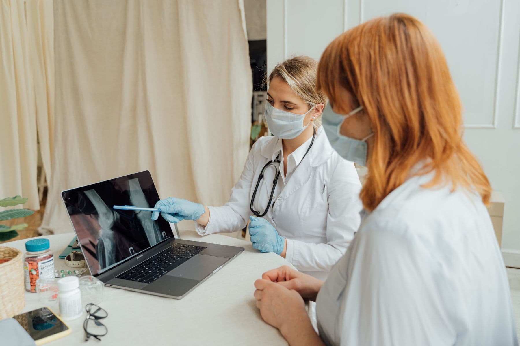 Premium orthopedic consultation room with mobility tools and joint care visuals